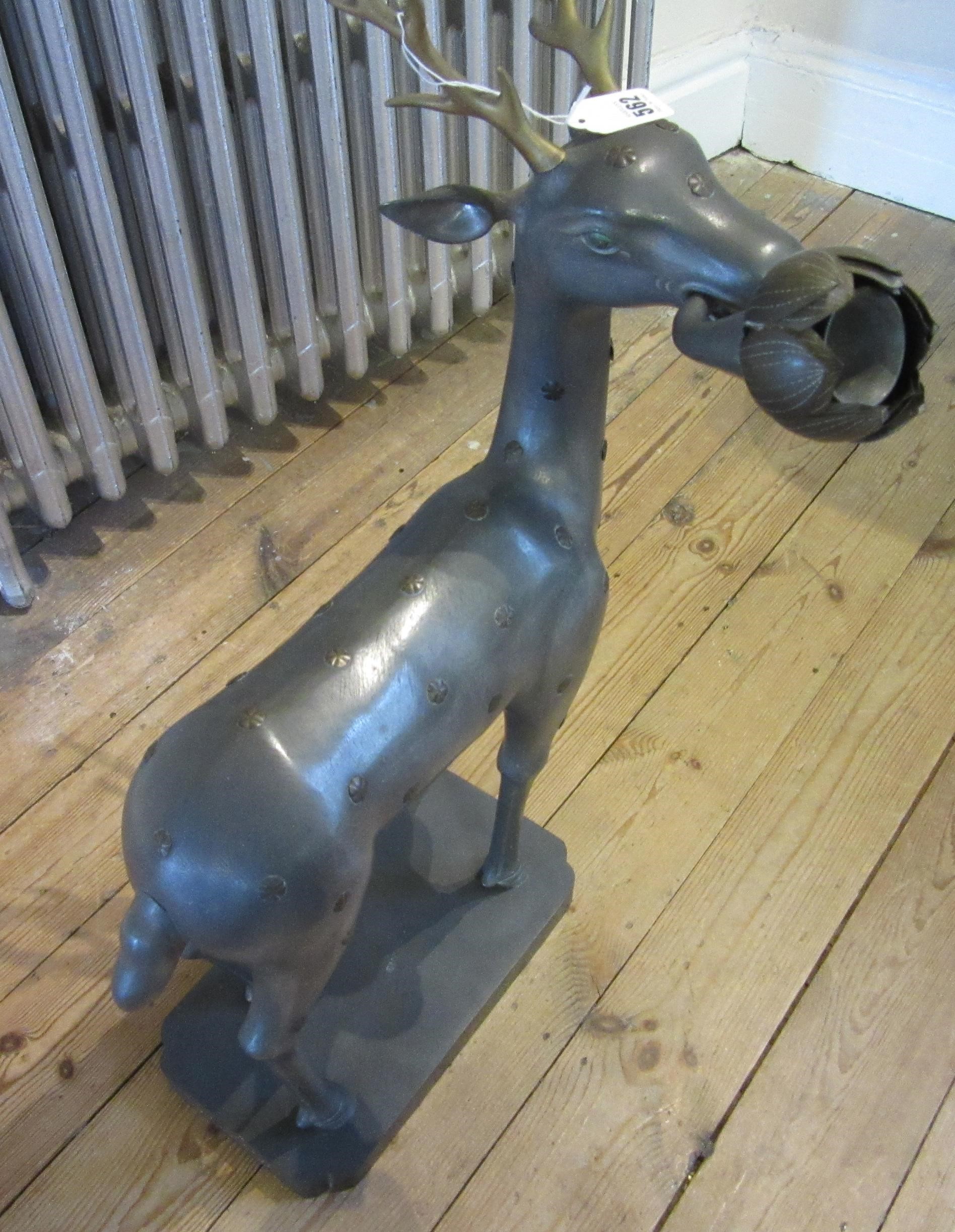 A CHINESE GREY PATINATED SPELTER FAWN CANDLE HOLDER, modern, with detachable antlers and studded Image