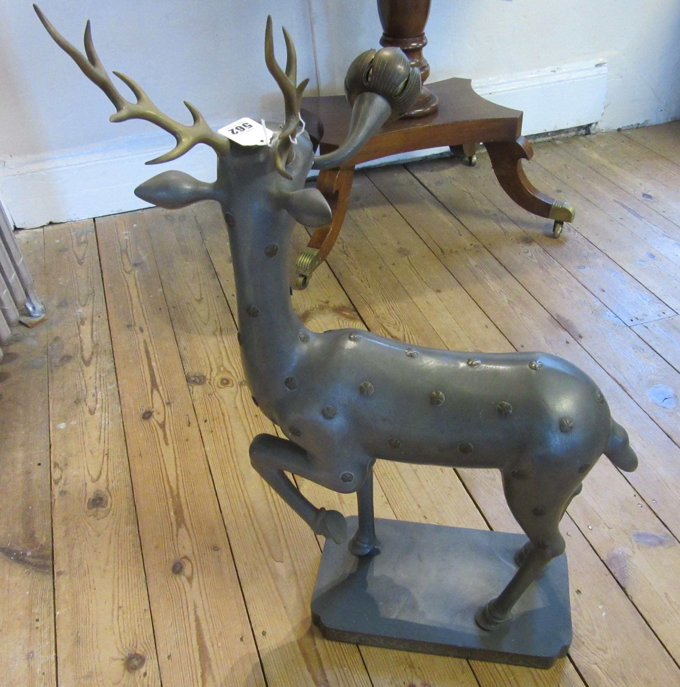 A CHINESE GREY PATINATED SPELTER FAWN CANDLE HOLDER, modern, with detachable antlers and studded Image