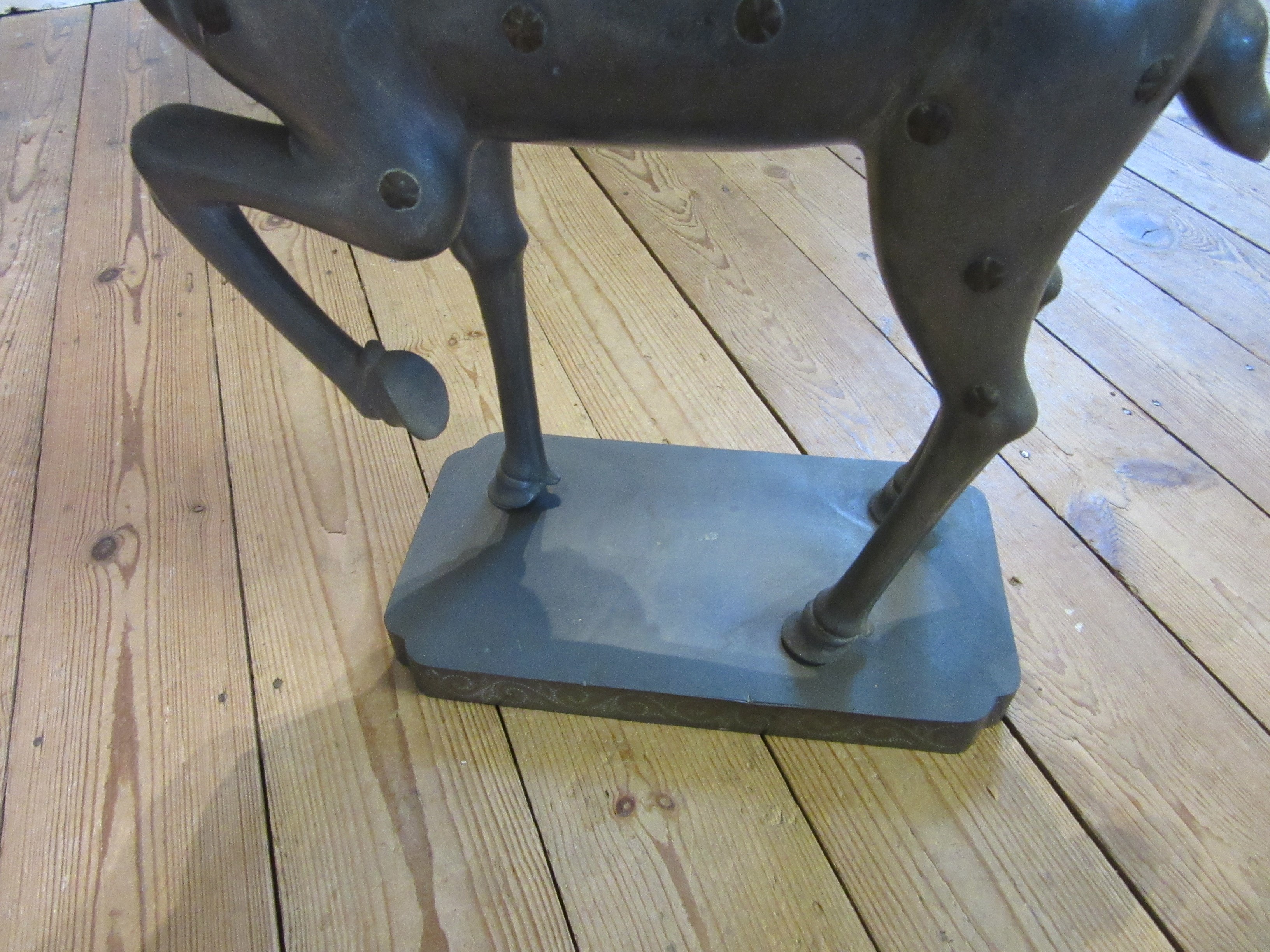 A CHINESE GREY PATINATED SPELTER FAWN CANDLE HOLDER, modern, with detachable antlers and studded Image