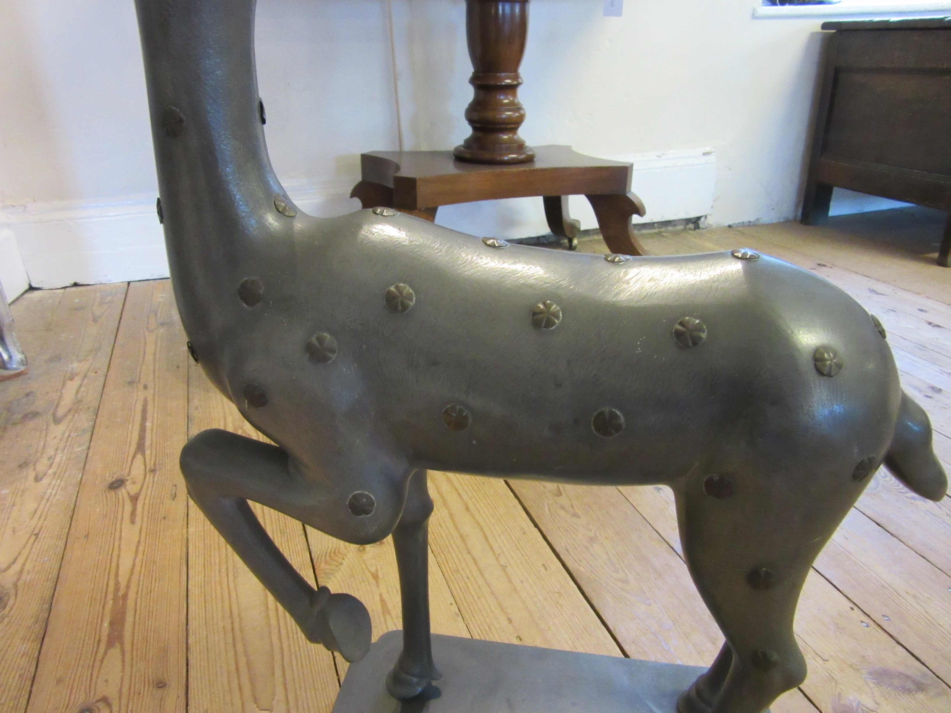 A CHINESE GREY PATINATED SPELTER FAWN CANDLE HOLDER, modern, with detachable antlers and studded Image