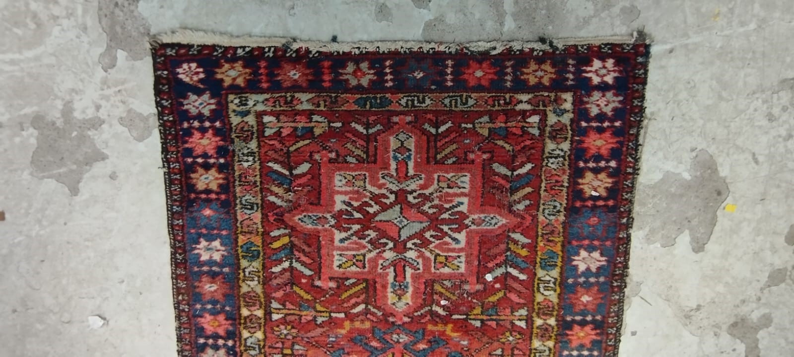 A NORTH WEST PERSIAN RUNNER, c.1900, the red field with alternating ivory and navy guls, within navy Image