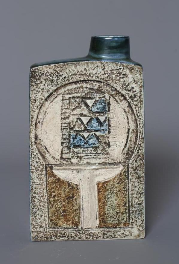A TROIKA CHIMNEY VASE by Linda Thomas, incised and decorated in shades of brown and blue with Image