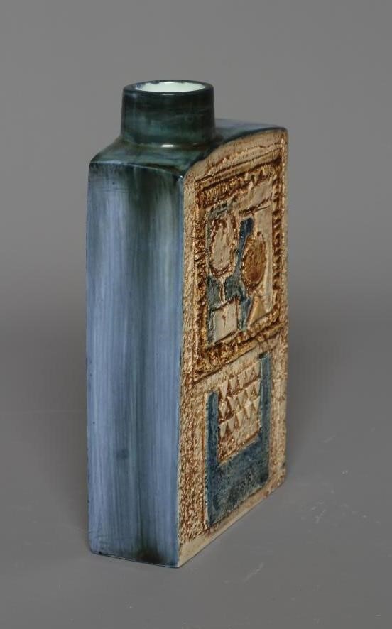 A TROIKA CHIMNEY VASE by Linda Thomas, incised and decorated in shades of brown and blue with Image