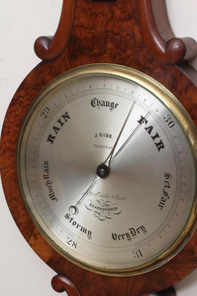 A VICTORIAN WALNUT WHEEL BAROMETER Image