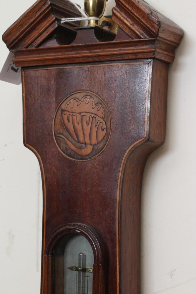 A GEORGIAN MAHOGANY WHEEL BAROMETER Image