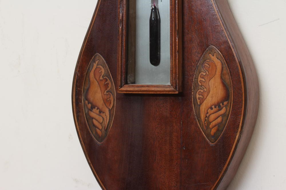 A GEORGIAN MAHOGANY WHEEL BAROMETER Image