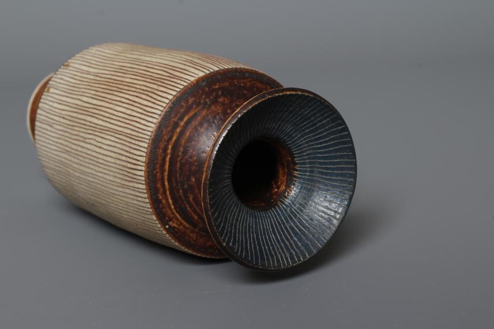 DAME LUCIE RIE DBE (1902-1995) A PORCELAIN VASE of cylindrical section with waisted neck and flared Image