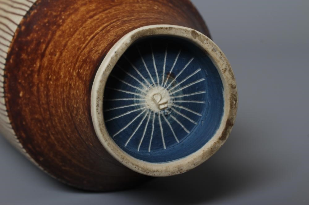 DAME LUCIE RIE DBE (1902-1995) A PORCELAIN VASE of cylindrical section with waisted neck and flared Image