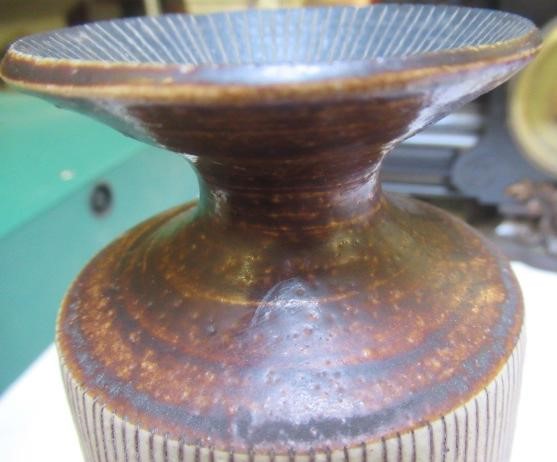 DAME LUCIE RIE DBE (1902-1995) A PORCELAIN VASE of cylindrical section with waisted neck and flared Image