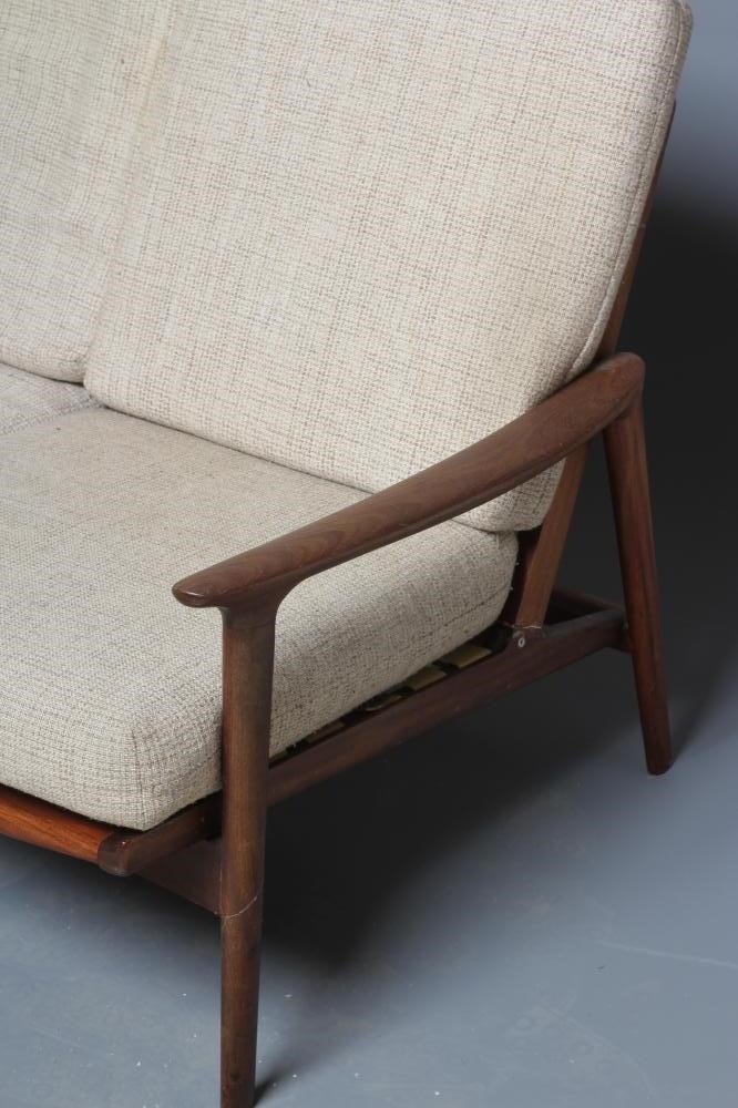A TEAK FRAMED LOUNGE SUITE probably Guy Rogers New York Image
