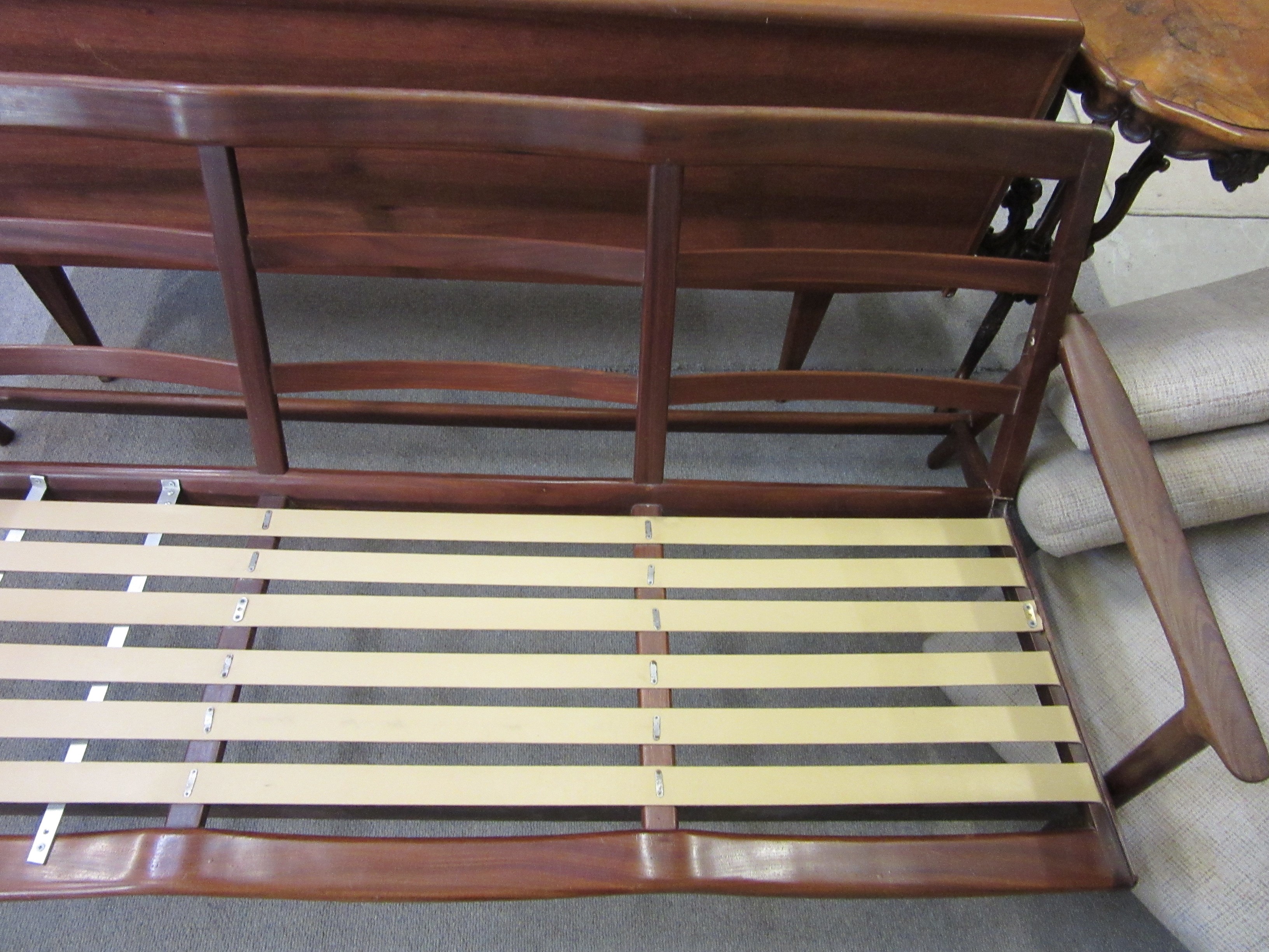 A TEAK FRAMED LOUNGE SUITE probably Guy Rogers New York Image