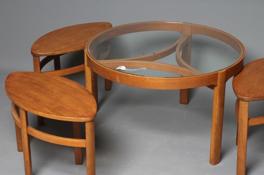 A NATHAN TRINITY TEAK NEST OF FOUR TABLES, mid 20th century, the larger circular table with glass Image