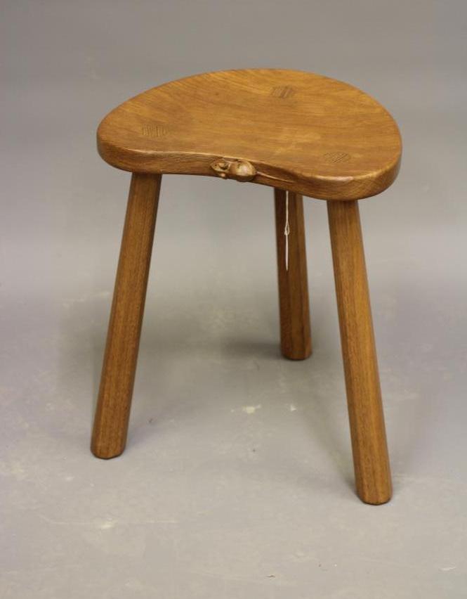 A ROBERT THOMPSON ADZED OAK COW STOOL Image