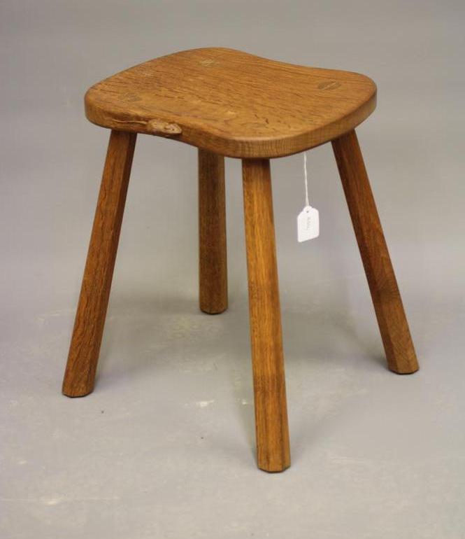 A ROBERT THOMPSON ADZED OAK COW STOOL Image