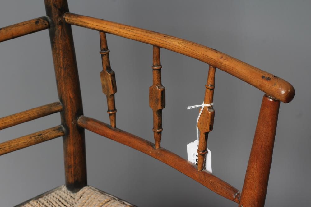 PHILIP WEBB FOR MORRIS & CO. - A "SUSSEX" ARMCHAIR in ash and beech with string seat and traces of Image