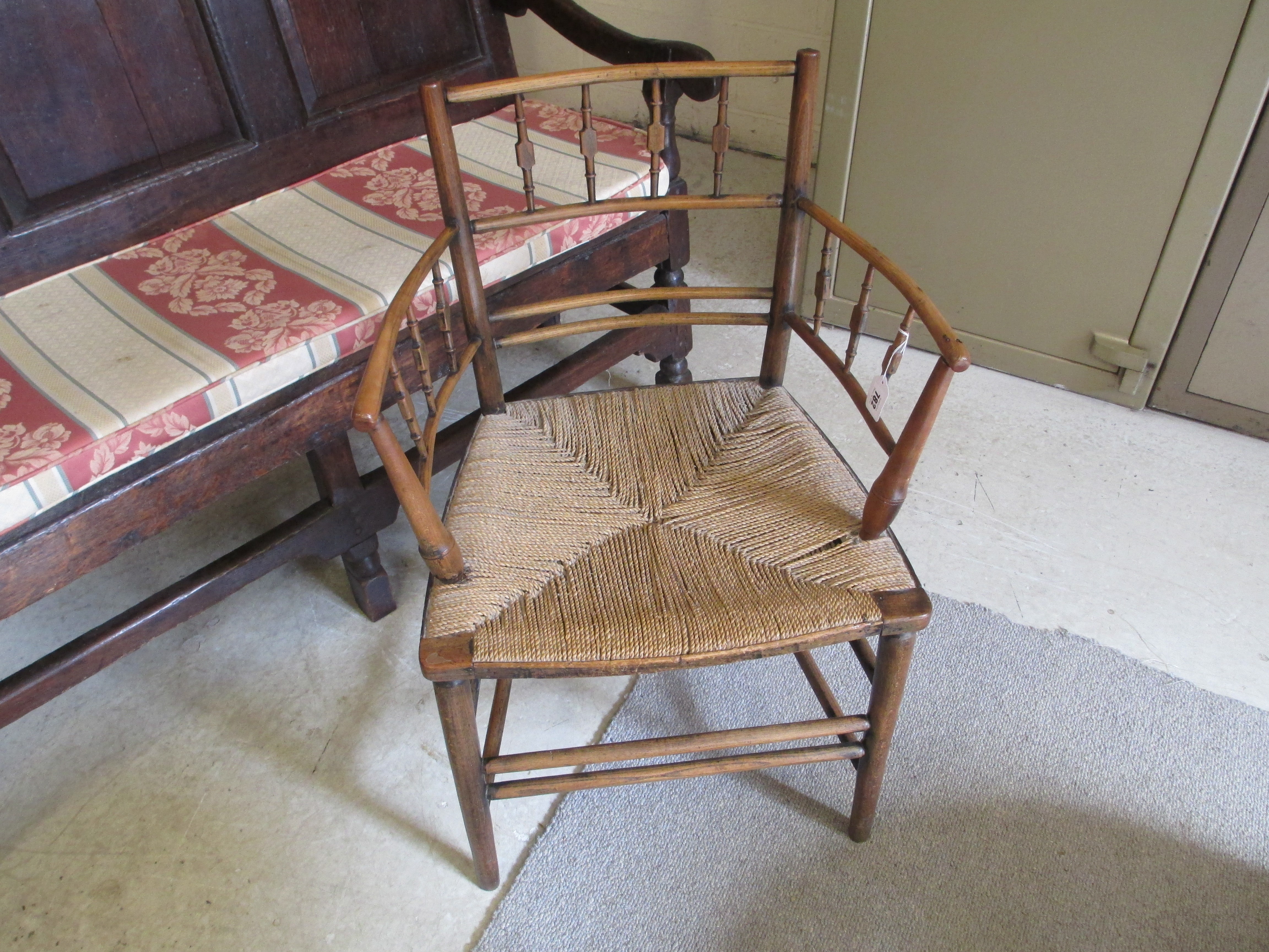 PHILIP WEBB FOR MORRIS & CO. - A "SUSSEX" ARMCHAIR in ash and beech with string seat and traces of Image