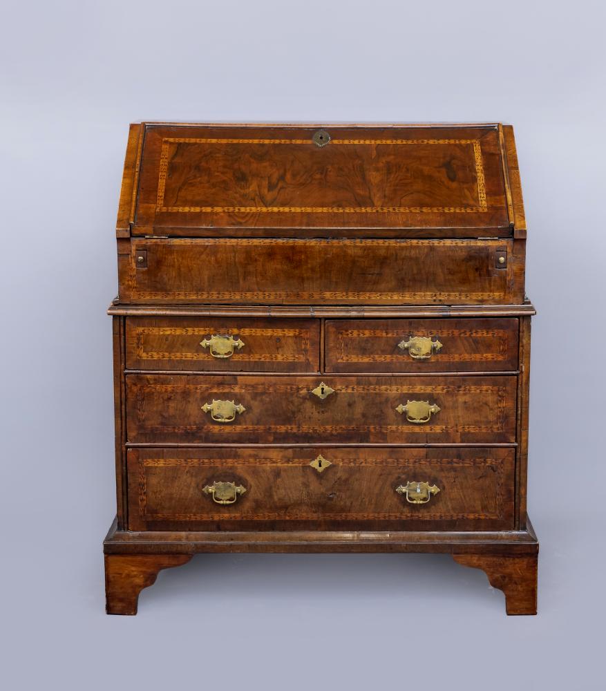 AN EARLY GEORGIAN WALNUT BUREAU Image