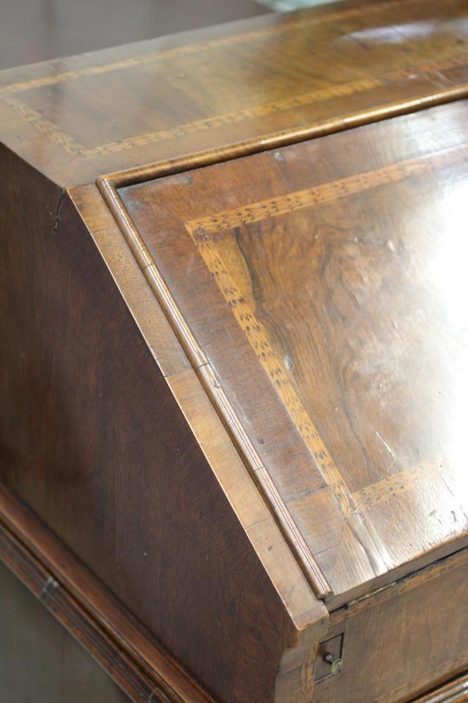 AN EARLY GEORGIAN WALNUT BUREAU Image