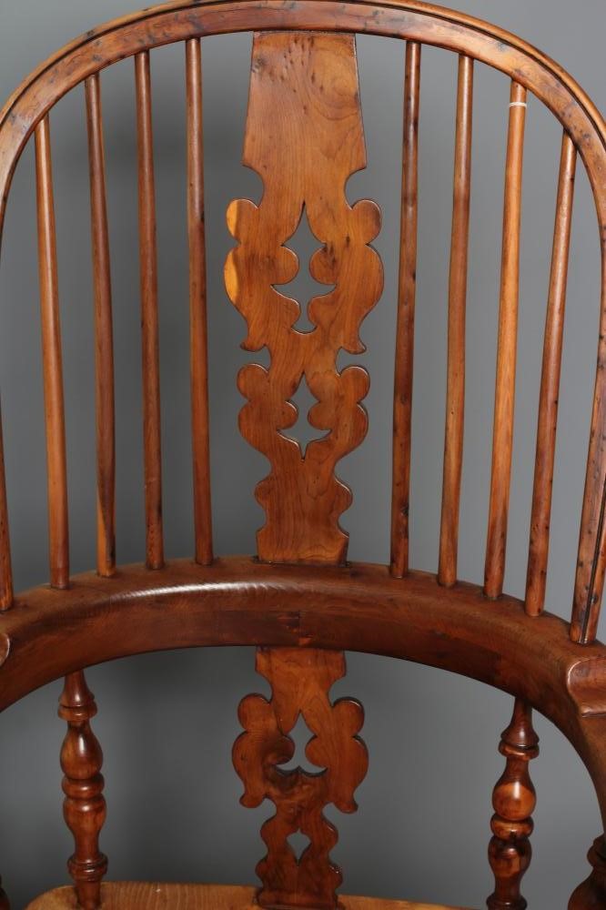 A YEW AND ELM BROAD ARM WINDSOR ARMCHAIR Image