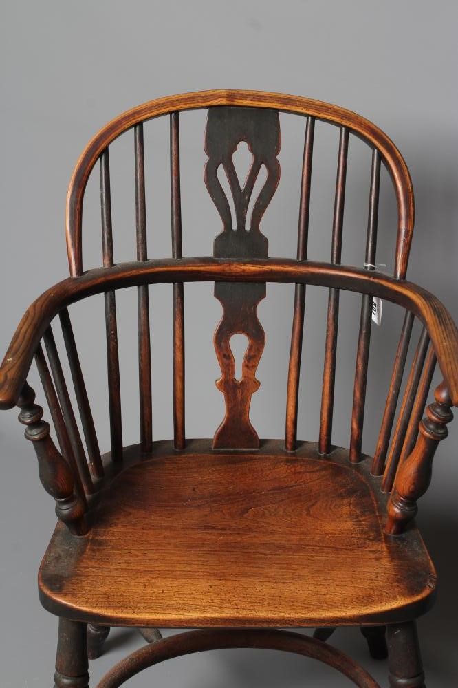 AN ASH AND ELM HOOPED WINDSOR ARMCHAIR Image