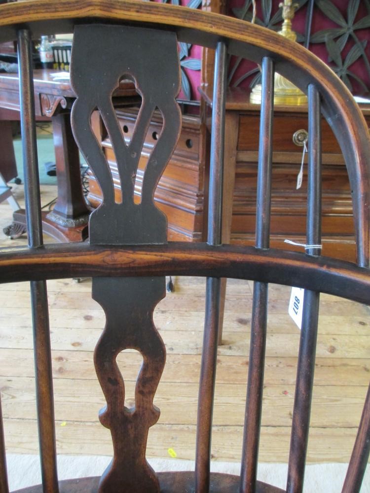 AN ASH AND ELM HOOPED WINDSOR ARMCHAIR Image