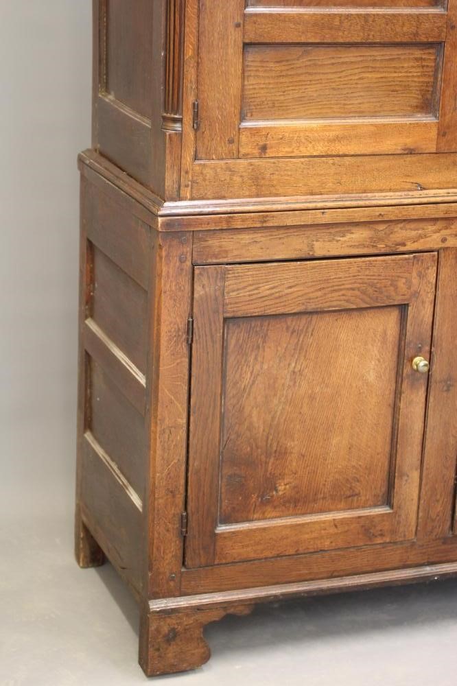 A GEORGIAN OAK PRESS CUPBOARD Image