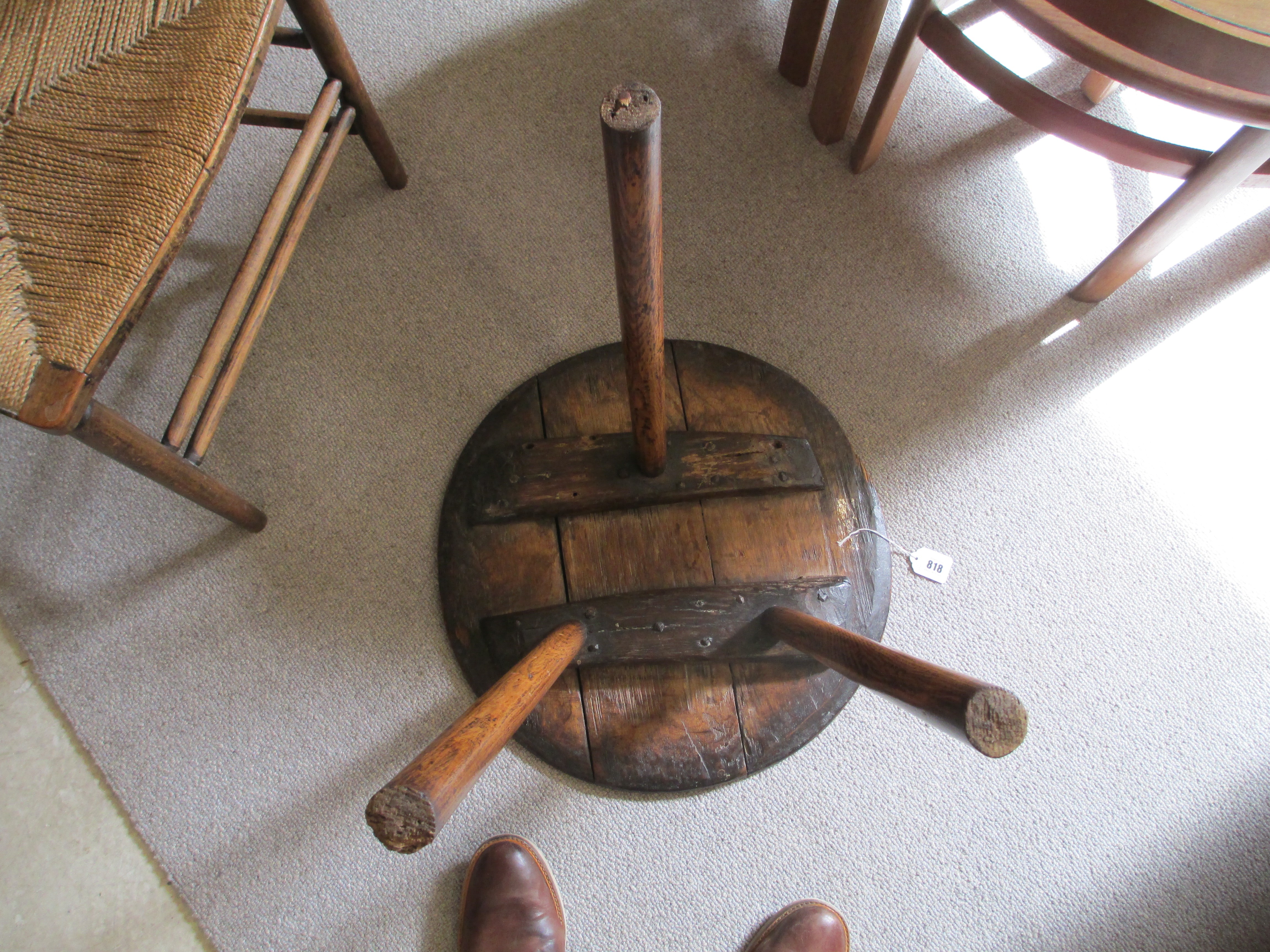 AN OAK CRICKET TABLE, 19th century, the three plank circular top with chamfered lower edge, raised Image