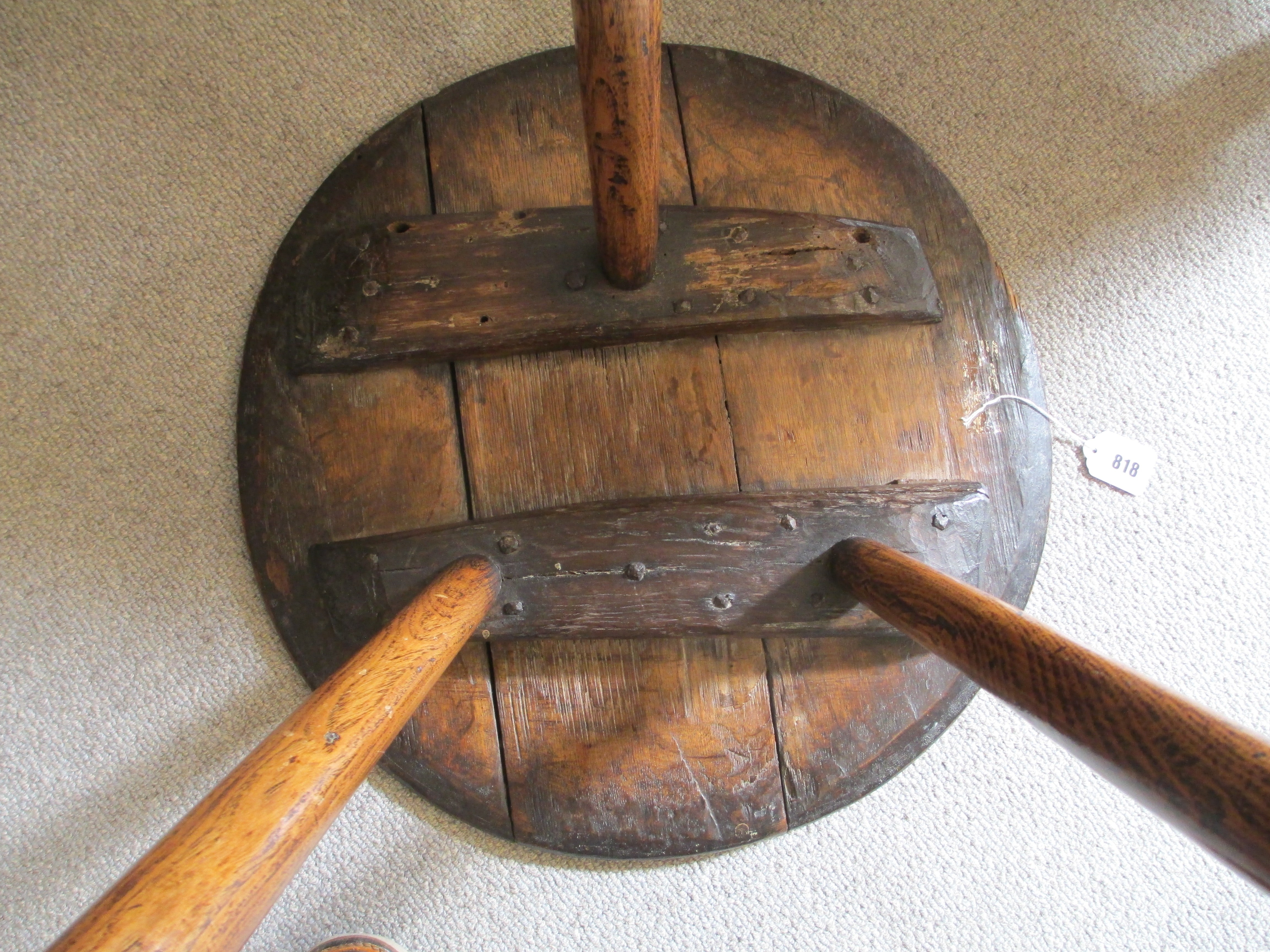 AN OAK CRICKET TABLE, 19th century, the three plank circular top with chamfered lower edge, raised Image