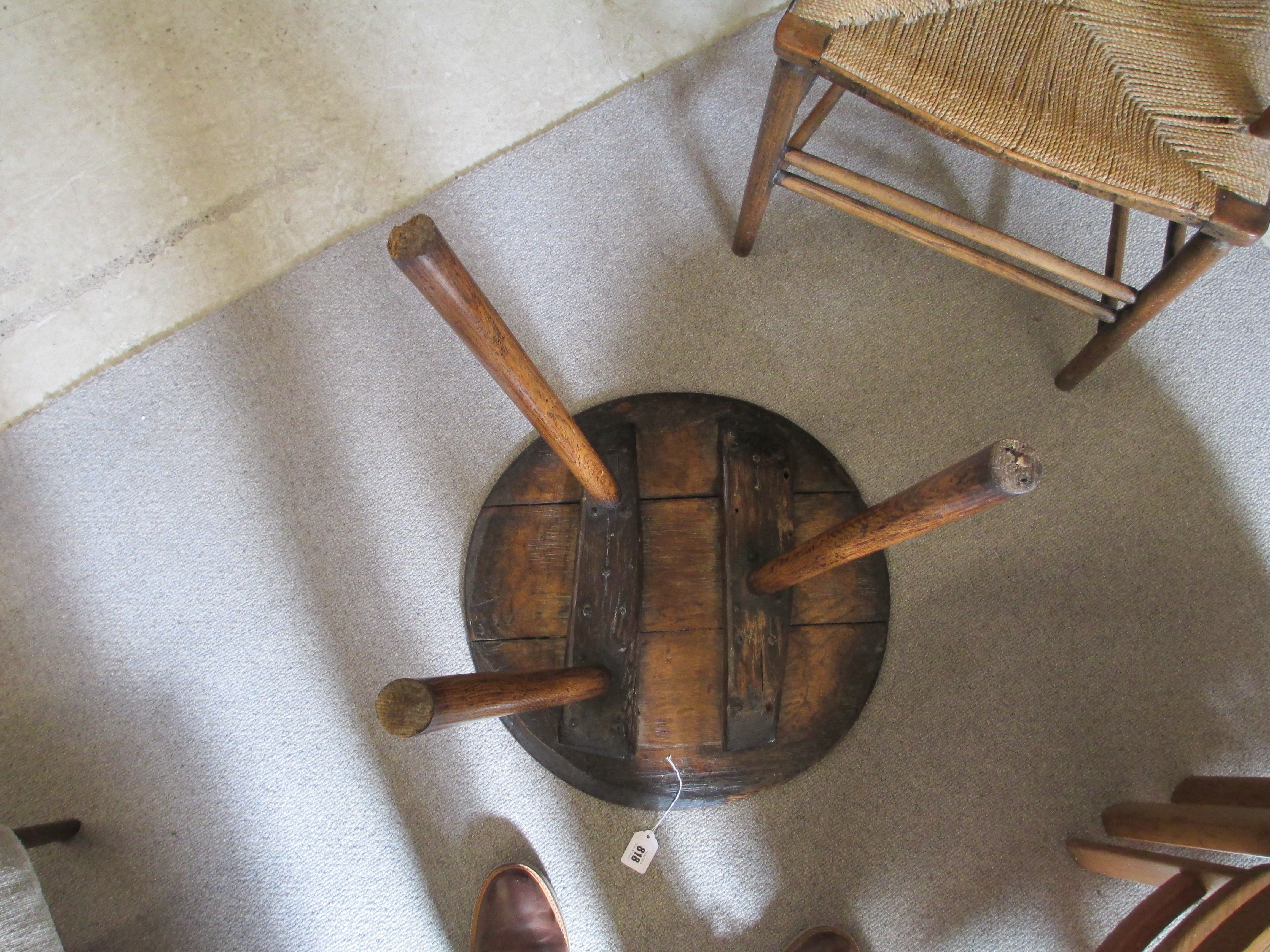 AN OAK CRICKET TABLE, 19th century, the three plank circular top with chamfered lower edge, raised Image