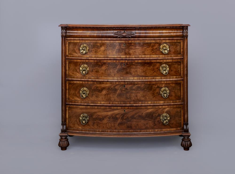 A REGENCY FIGURED MAHOGANY BOW FRONT CHEST Image