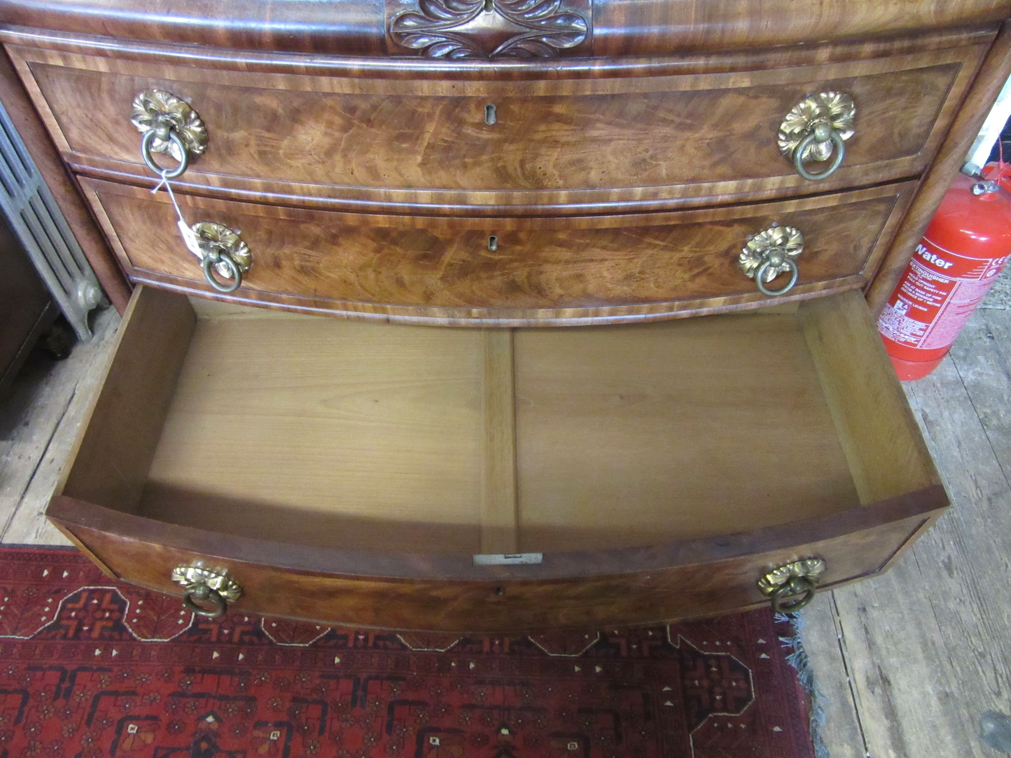 A REGENCY FIGURED MAHOGANY BOW FRONT CHEST Image