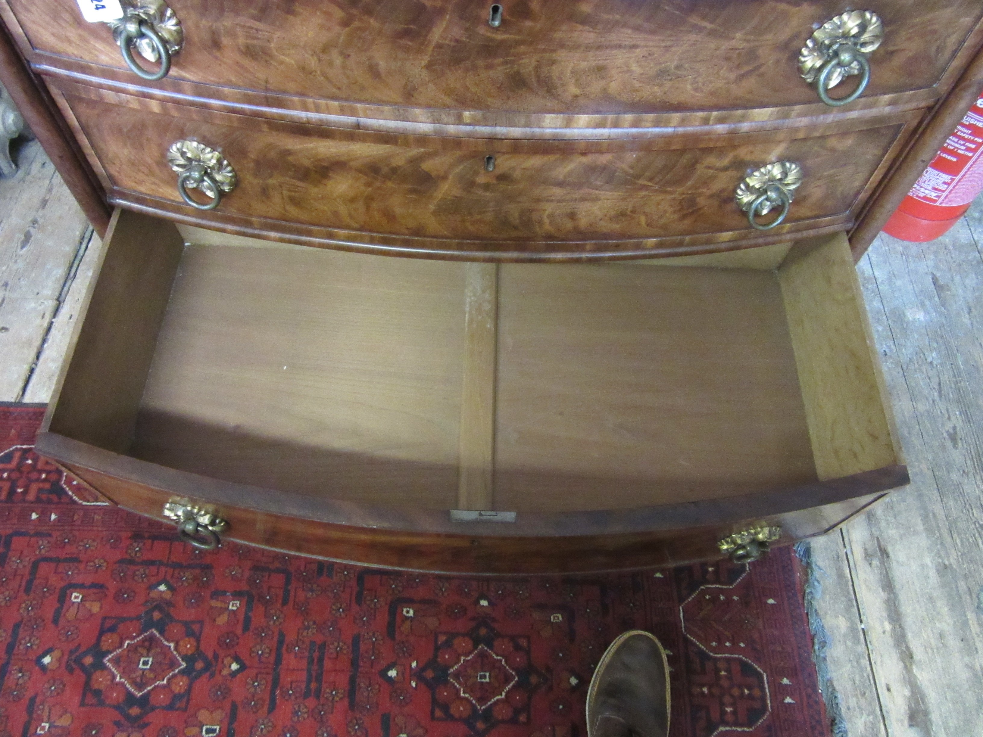 A REGENCY FIGURED MAHOGANY BOW FRONT CHEST Image