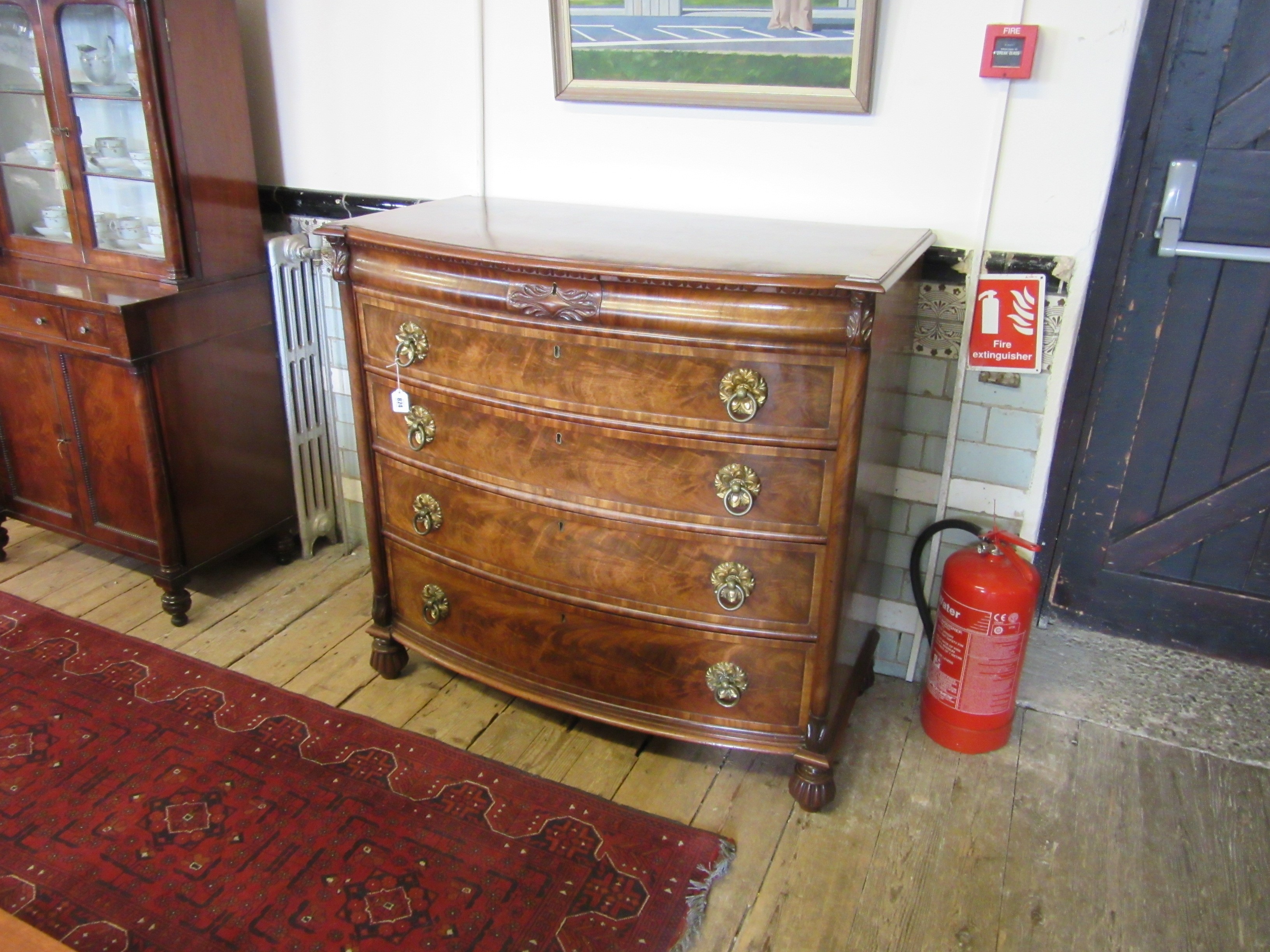 A REGENCY FIGURED MAHOGANY BOW FRONT CHEST Image