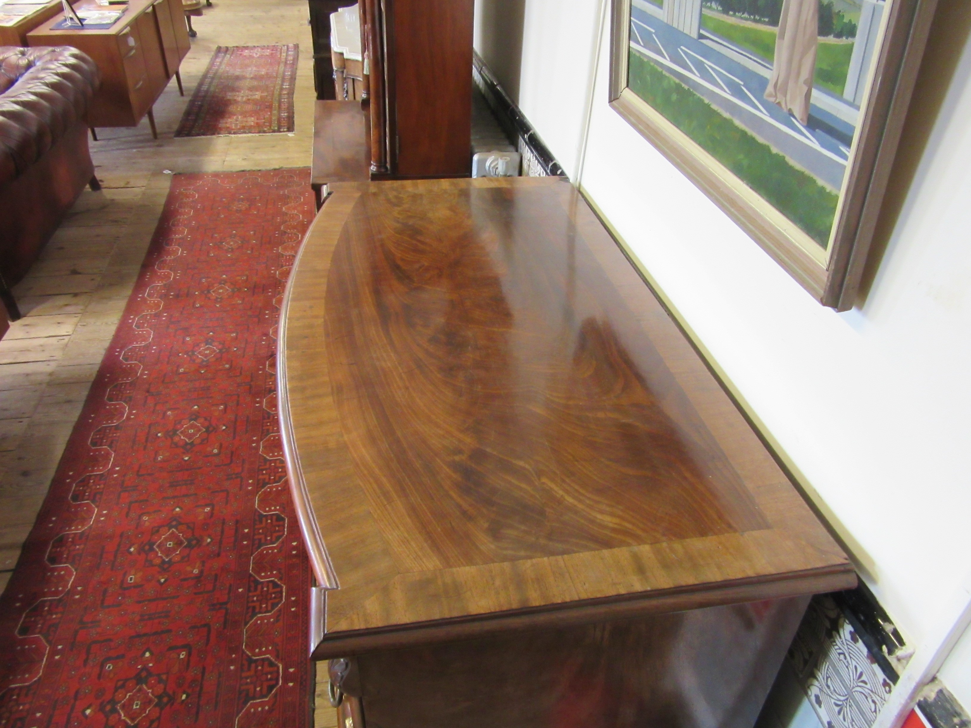 A REGENCY FIGURED MAHOGANY BOW FRONT CHEST Image