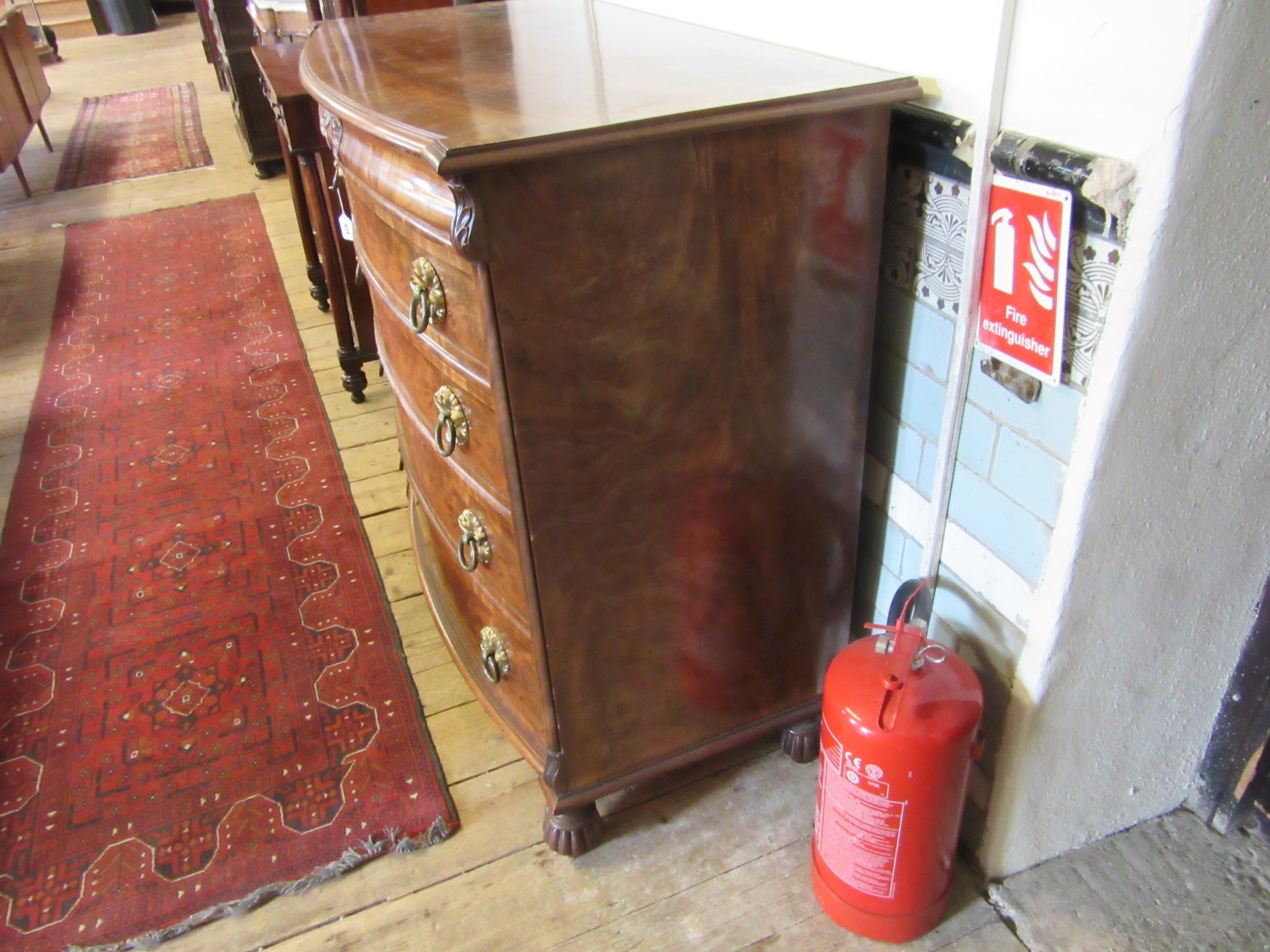 A REGENCY FIGURED MAHOGANY BOW FRONT CHEST Image