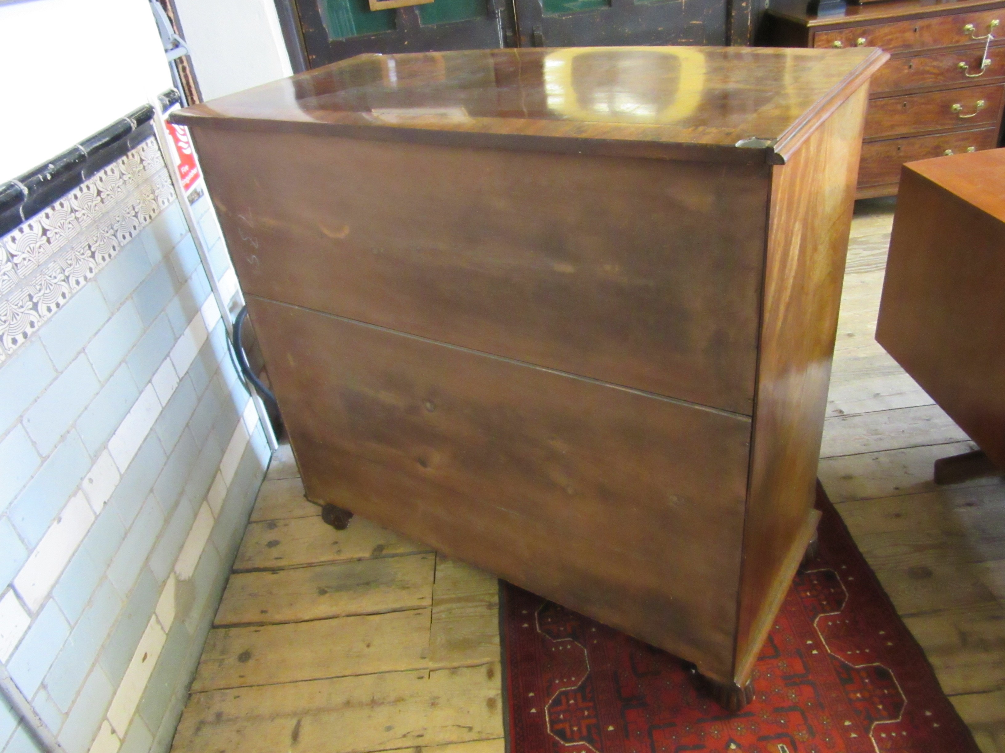 A REGENCY FIGURED MAHOGANY BOW FRONT CHEST Image