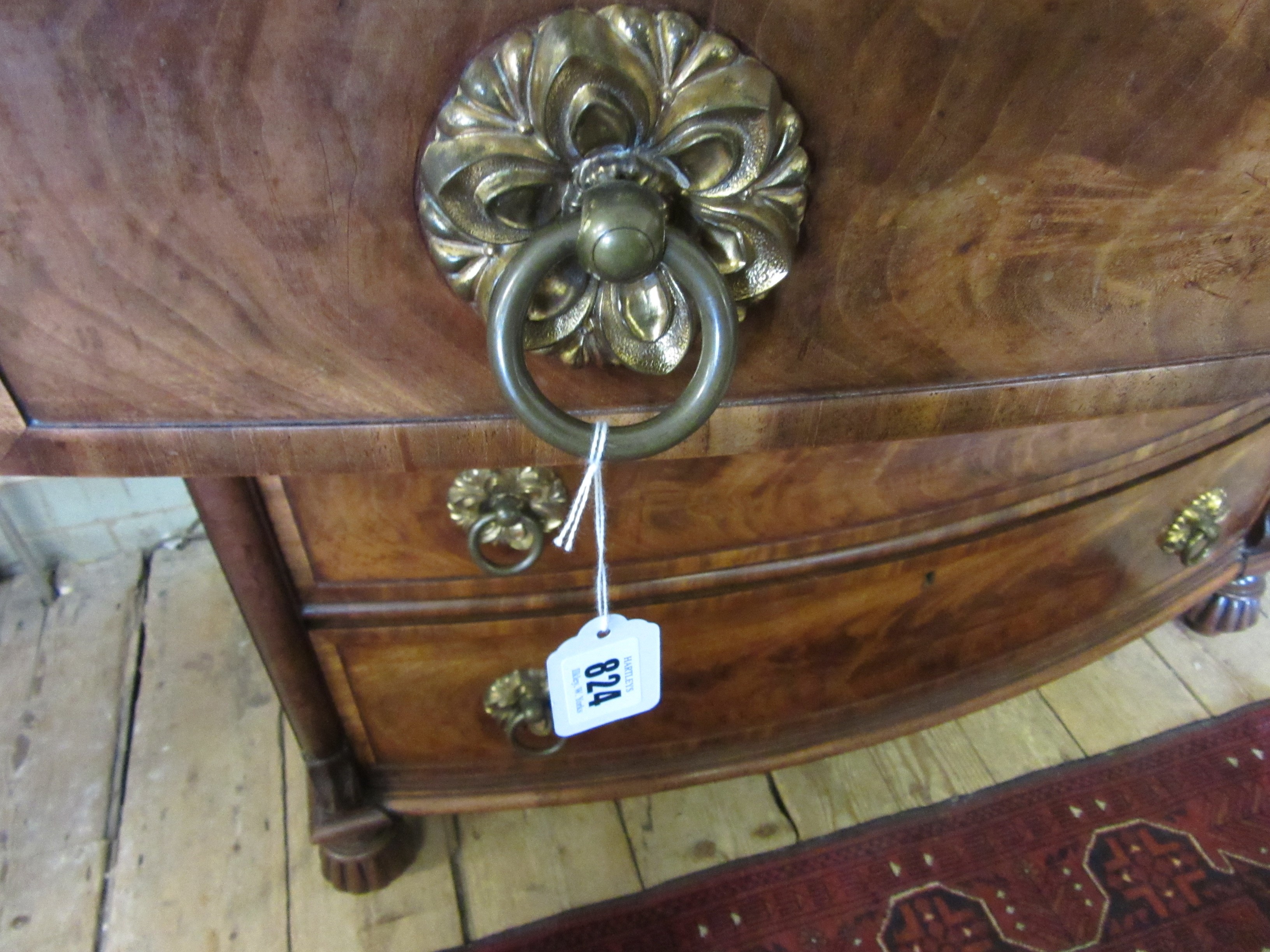 A REGENCY FIGURED MAHOGANY BOW FRONT CHEST Image
