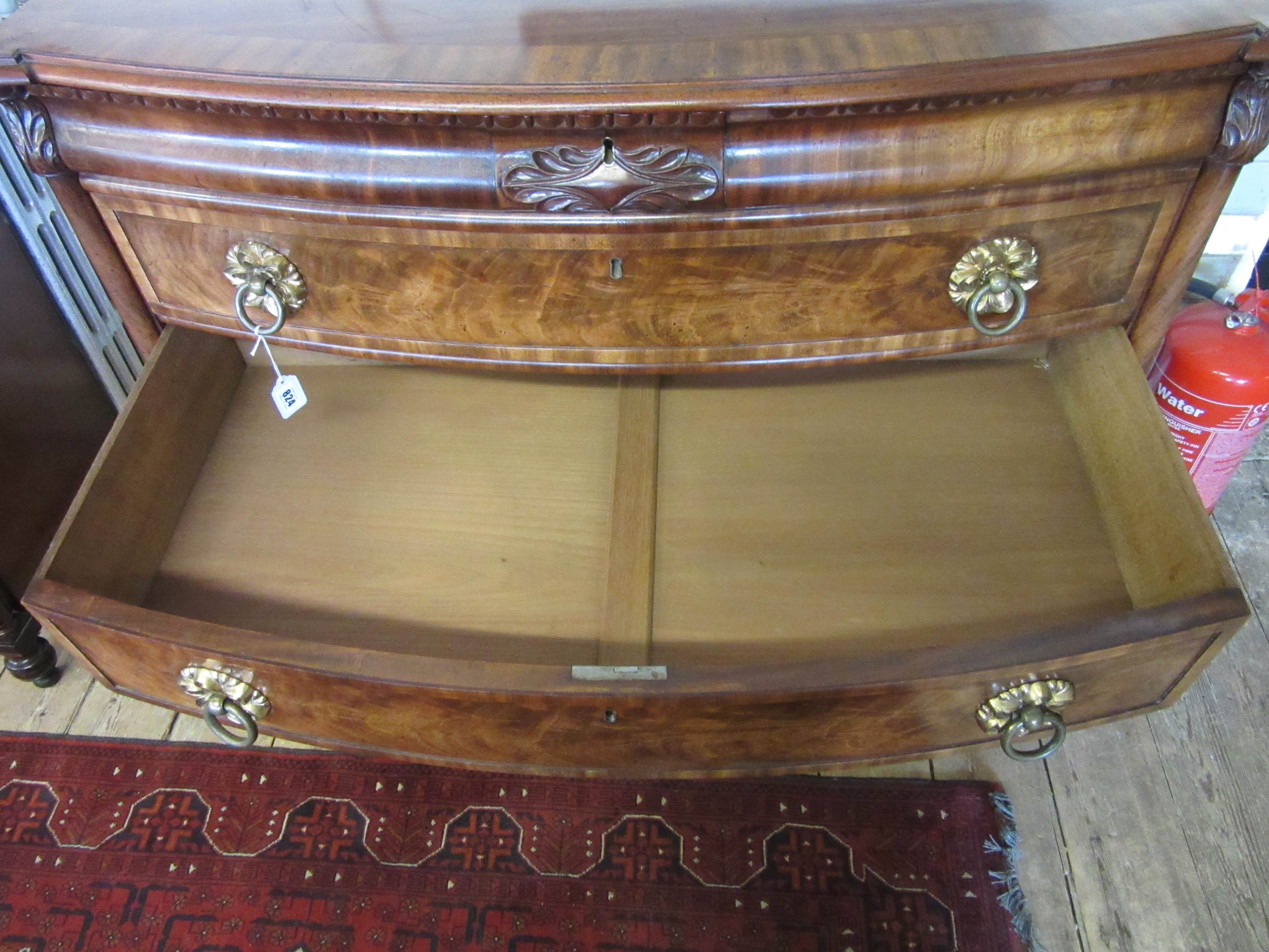 A REGENCY FIGURED MAHOGANY BOW FRONT CHEST Image