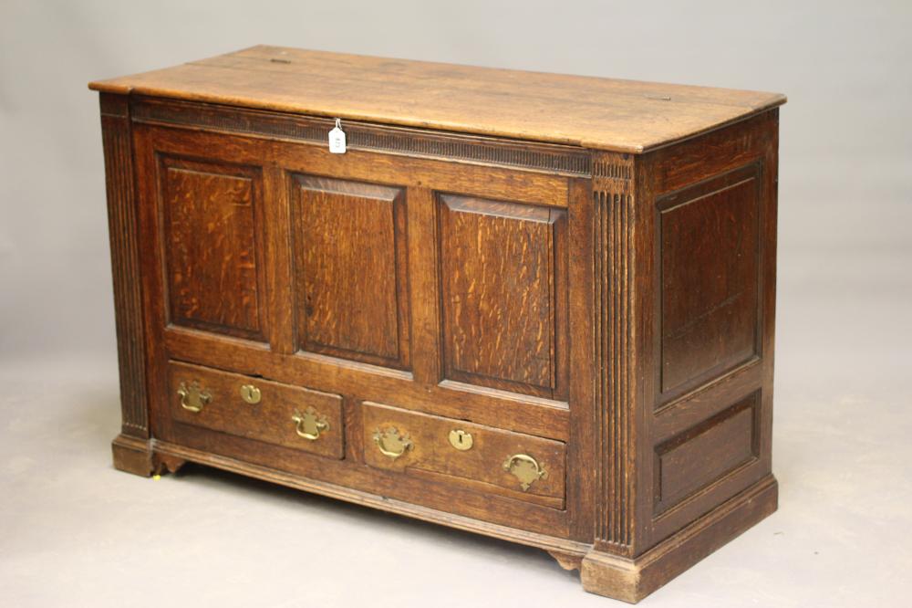A GEORGIAN JOINED OAK PANELLED CHEST of inverted breakfront form Image