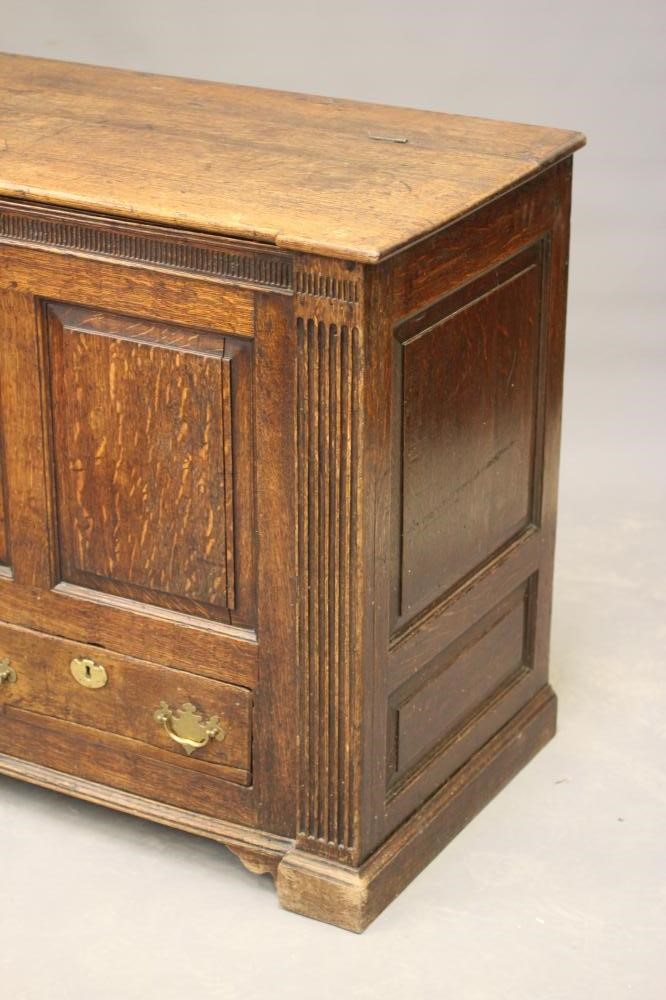 A GEORGIAN JOINED OAK PANELLED CHEST of inverted breakfront form Image