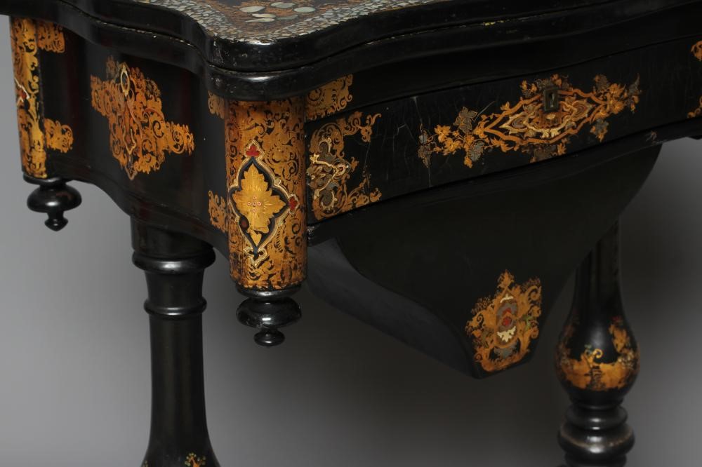 A VICTORIAN PAPIER MACHE WORK/GAMES TABLE Image