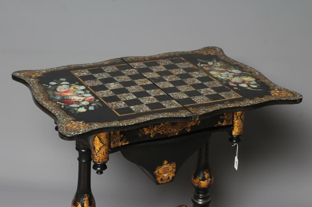 A VICTORIAN PAPIER MACHE WORK/GAMES TABLE Image