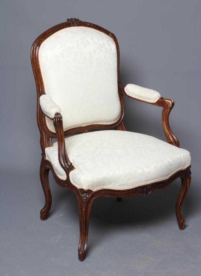 A STAINED BEECH ARMCHAIR Image