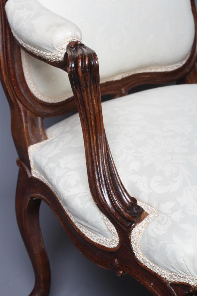 A STAINED BEECH ARMCHAIR Image