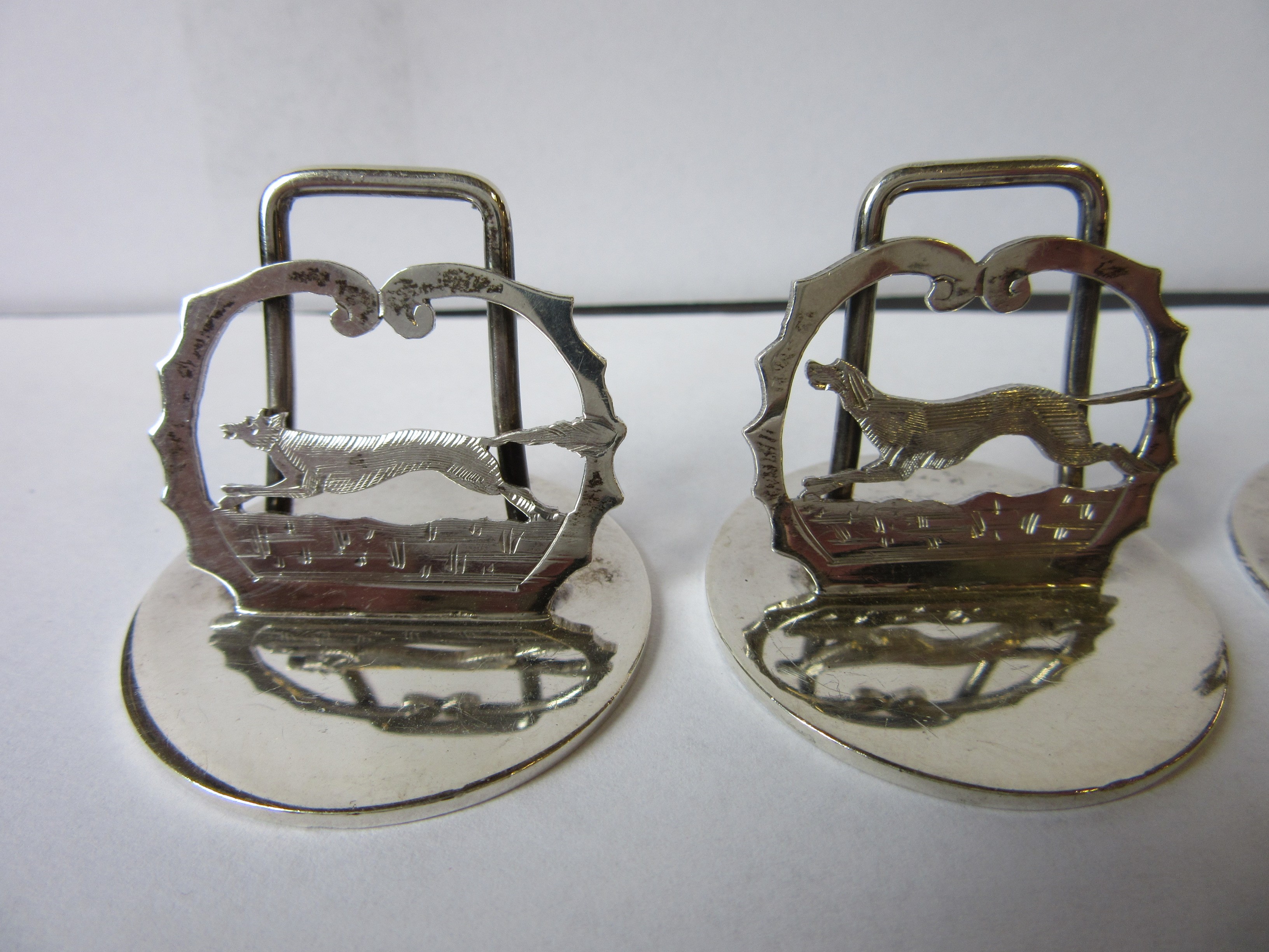 A COMPOSITE SET OF EIGHT NOVELTY MENU/PLACE CARD HOLDERS Image