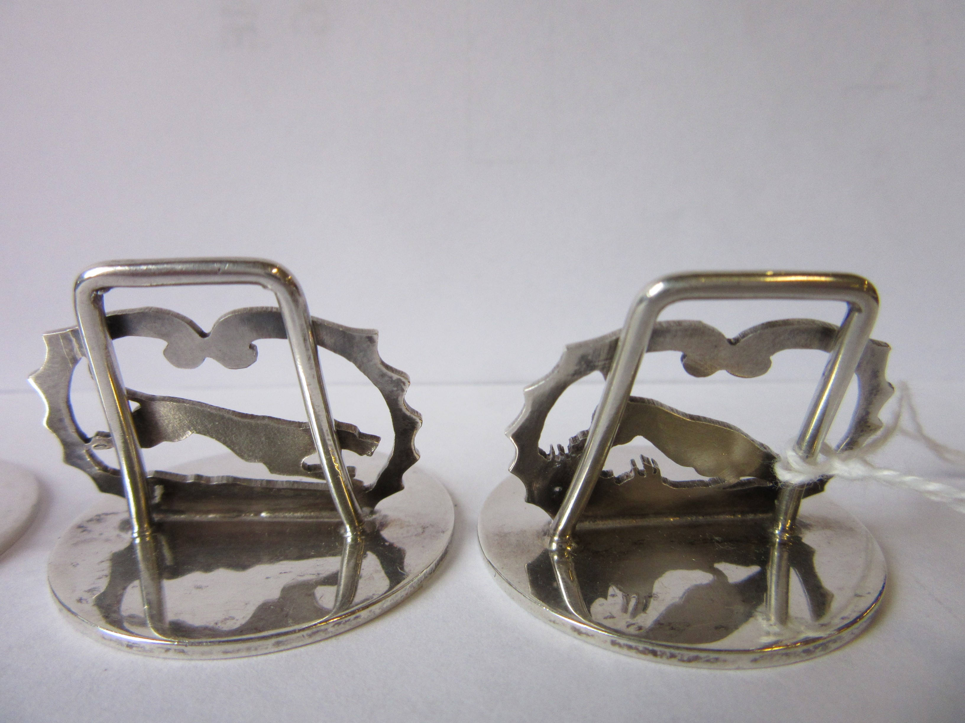 A COMPOSITE SET OF EIGHT NOVELTY MENU/PLACE CARD HOLDERS Image