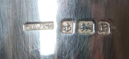 AN ART DECO SMALL BOTTLE HOLDER by S J Levi & Co., Birmingham 1939, of plain cylindrical form with Image