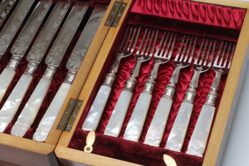 A LATE VICTORIAN EPNS DESSERT SERVICE comprising twelve pairs of fruit knives and forks with ivy Image