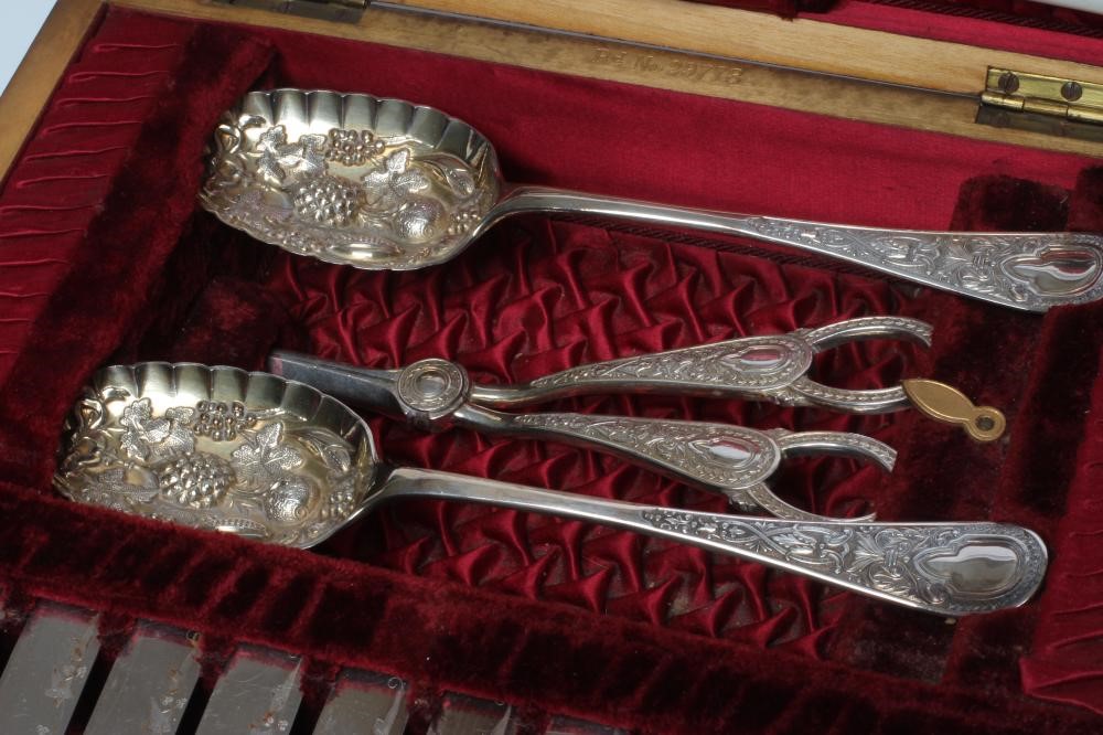 A LATE VICTORIAN EPNS DESSERT SERVICE comprising twelve pairs of fruit knives and forks with ivy Image