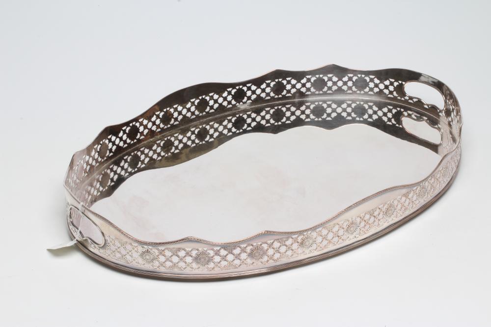 A LARGE PLATED ON COPPER OVAL TRAY with rosette and trellis pierced gallery Image